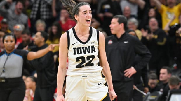 Caitlin Clark celebrates after a basket.